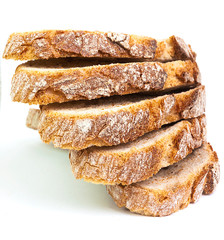 RUSTIC BREAD IN SLICES ON A WHITE BACKGROUND