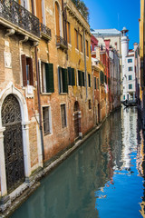 Narrow canals are famous and typical in Venice,Italy, 2019