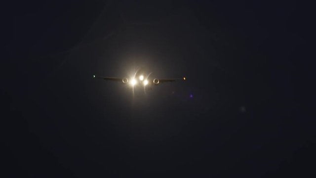 Night video of a flying plane towards the Warsaw Chopin Airport in Poland.