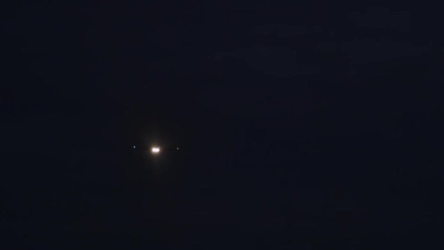 Night video of a fast flying plane towards the Warsaw Chopin Airport in Poland.