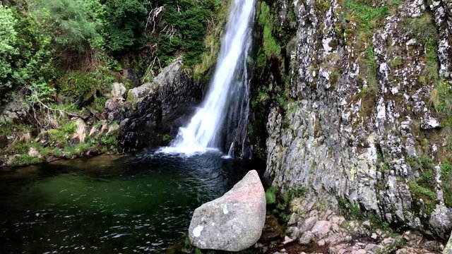 Waterfall in Manteigas, Serra da Estrela (Mountain of Star) in Portugal called Poco do Inferno (Hell Pit)
