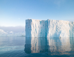 The glaciers are melting on arctic ocean in Greenland. Big glaciers day by day broking and...