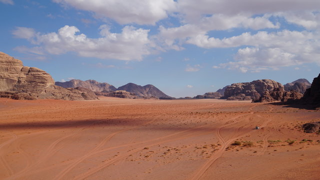 Panoramic view to the landscape of the Wadi Rum desert with red sand dunes and rocks in Jordan. © vadim_ozz
