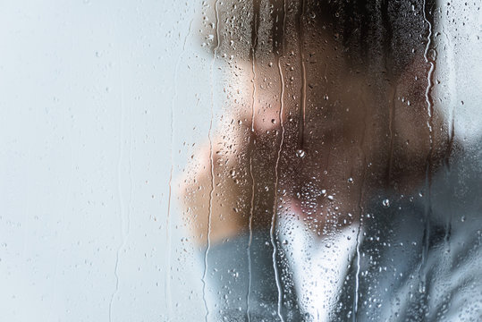 guy crying in rain