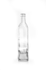 Transparent glass vintage boho style distorted bottle on a white background