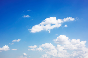 Blue sky background and white clouds soft focus, and copy space