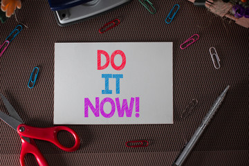 Conceptual hand writing showing Do It Now. Concept meaning not hesitate and start working or doing...