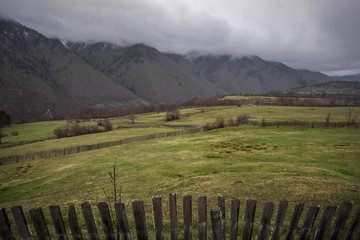 Fototapeta na wymiar mestia meadow and wooden fence
