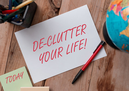 Word writing text De Clutter Your Life. Business photo showcasing remove unnecessary items from untidy or overcrowded places Writing equipments and sheets with artificial globe on the wooden desk