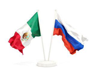 Two waving flags of Mexico and russia isolated on white