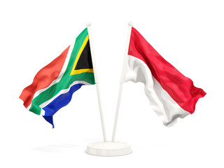 Two waving flags of South Africa and indonesia isolated on white