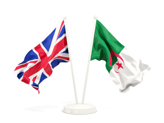 Two waving flags of UK and algeria isolated on white