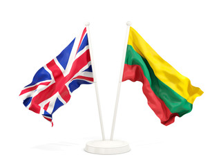 Two waving flags of UK and lithuania isolated on white