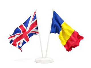 Two waving flags of UK and romania isolated on white