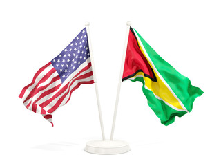 Two waving flags of United States and guyana isolated on white