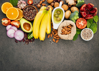 Ingredients for the healthy foods selection  .The concept of healthy food set up on dark concrete background copy space.