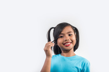 Fototapeta premium Portrait little girl makeup with her face