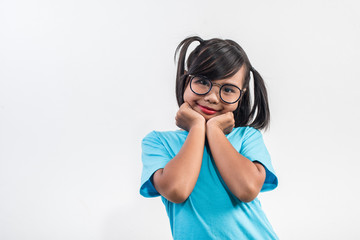 Portrait of Funny little girl acting in studio shot