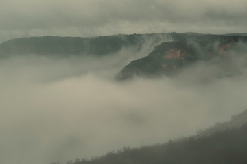 Low cloud in a valley in the mountains.