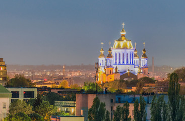 Fototapeta na wymiar View of the evening city and the Intercession Cathedral of the city of Rivne, Ukraine.