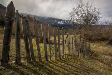 old wood fence at meadow in mestia