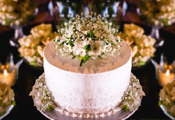 Obraz na płótnie Canvas Rustic wedding concept. Wedding cake decorated with flowers.