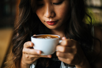Portrait asian woman smiling relax in coffee shop cafe