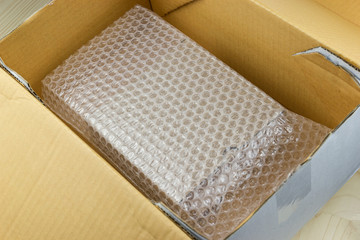 Fototapeta na wymiar Bubbles covering the box by bubble wrap for protection product