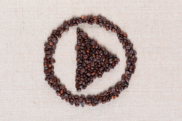 Close up of play circle sign from coffee beans