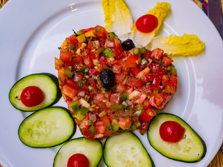Heart shaped fresh maroccan vegetable salad. Healthy food heart shaped fresh vegetable salad