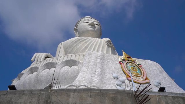 Slowmotion steadicam shot of a Big Buddha statue on Phuket island. Travel to Thailand concept