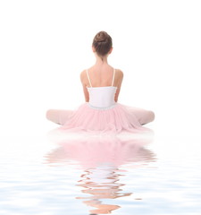 Fototapeta premium young girl ballerina posing on white background