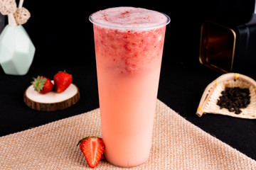 Fresh pressed frozen tea beverage in black background