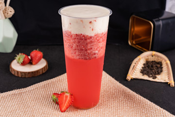 Fresh pressed frozen tea beverage in black background