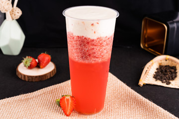 Fresh pressed frozen tea beverage in black background