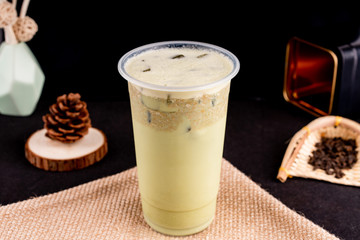 Fresh pressed frozen tea beverage in black background