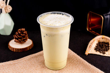 Fresh pressed frozen tea beverage in black background