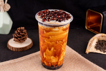 Fresh pressed frozen tea beverage in black background