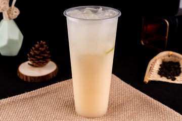 Fresh pressed frozen tea beverage in black background