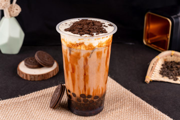 Fresh pressed frozen tea beverage in black background