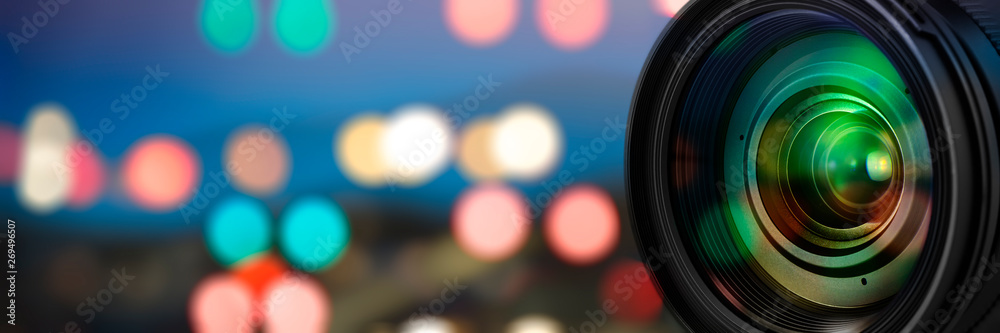 Poster Camera lens with reflections on blur background