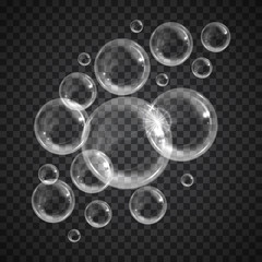 Realistic floating soap bubbles on transparent background. Design element for advertising booklet, flyer or poster