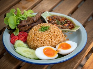chili paste fried rice with grill pork with Fish sauce with chili. Fish sauce with red chili and Boiled egg