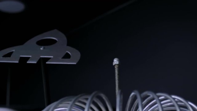 High-voltage experiment with tesla coil at futuristic technology exhibition. Wireless power, electricity, education, energy, science and physics concept