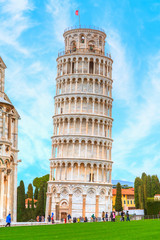 The Leaning Tower and Pisa Cathedral at bright blue sky - Pisa, Italy