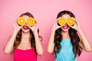 Close up photo two people beautiful she her ladies hands arms hold hide eyes specs organic nature fruits party festive chill hang out wear colorful dresses formal-wear isolated pink bright background
