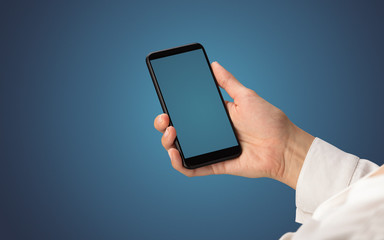 Mockup for female hand using frameless smartphone with dark background
