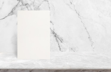 Blank Eco textured paper poster on marble stone table top at white marble stone wall background,Template mock up for adding your design.