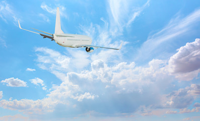 Passenger Airplane is flying in blue cloudy sky 