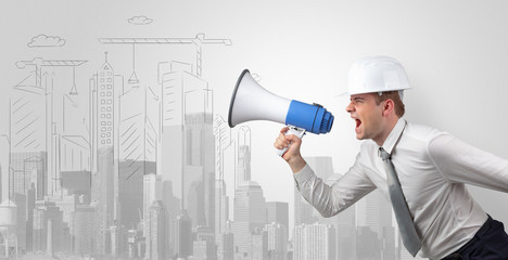 Fototapeta premium Young supervisor architect yelling to a big city panorama 